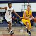 Pioneer senior Duane Simpson-Redmond defends Saline junior Erik Jacobsen on Friday, Feb. 1. Daniel Brenner I AnnArbor.com